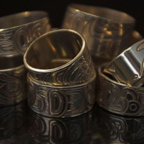 Hand Carved silver half inch rings by North West Coast Native artists